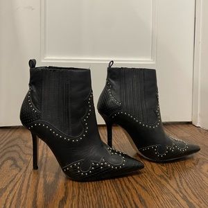 Studded heeled boots.